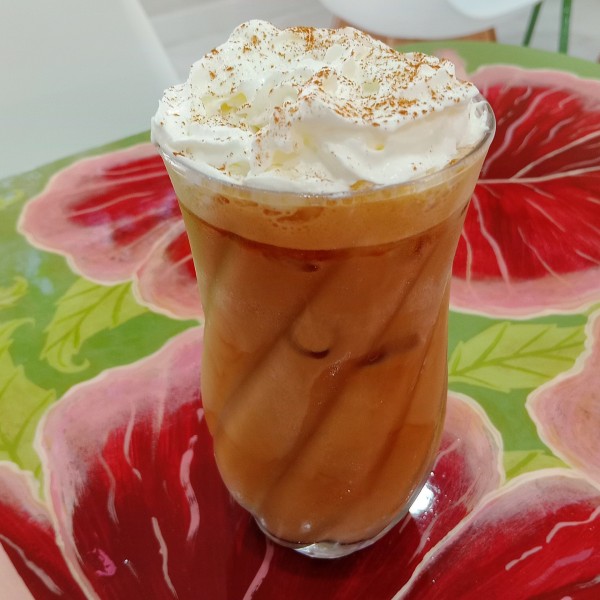 Hibiscus Cafe Oistins espresso frappe frappuccino blended coffee with whipped cream in coconut, vanilla, hibiscus, mocha, and strawberry flavours